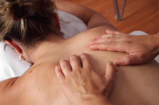 woman giving head massage to woman